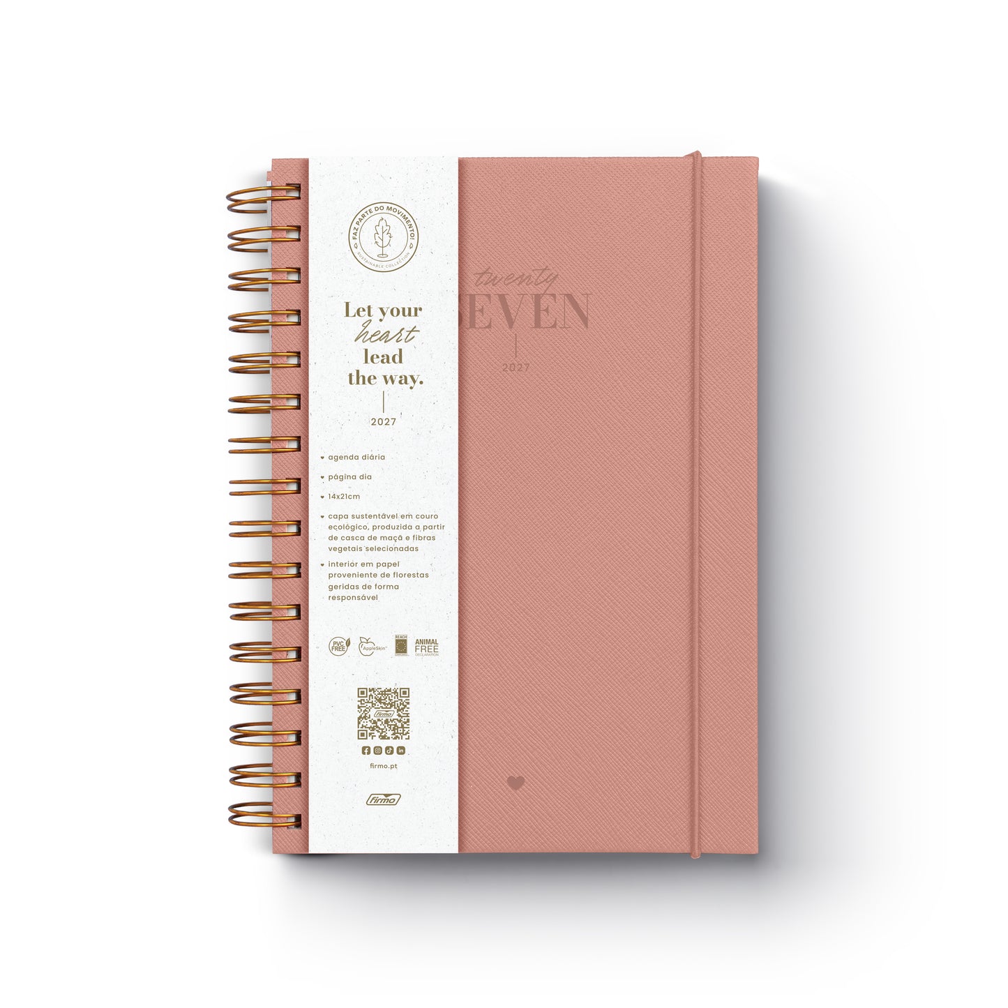 Agenda diária de 2027 Eco Millie com capa de design ecológico, encadernação em espiral e fecho de elástico disposta sobre uma secretária de trabalho.