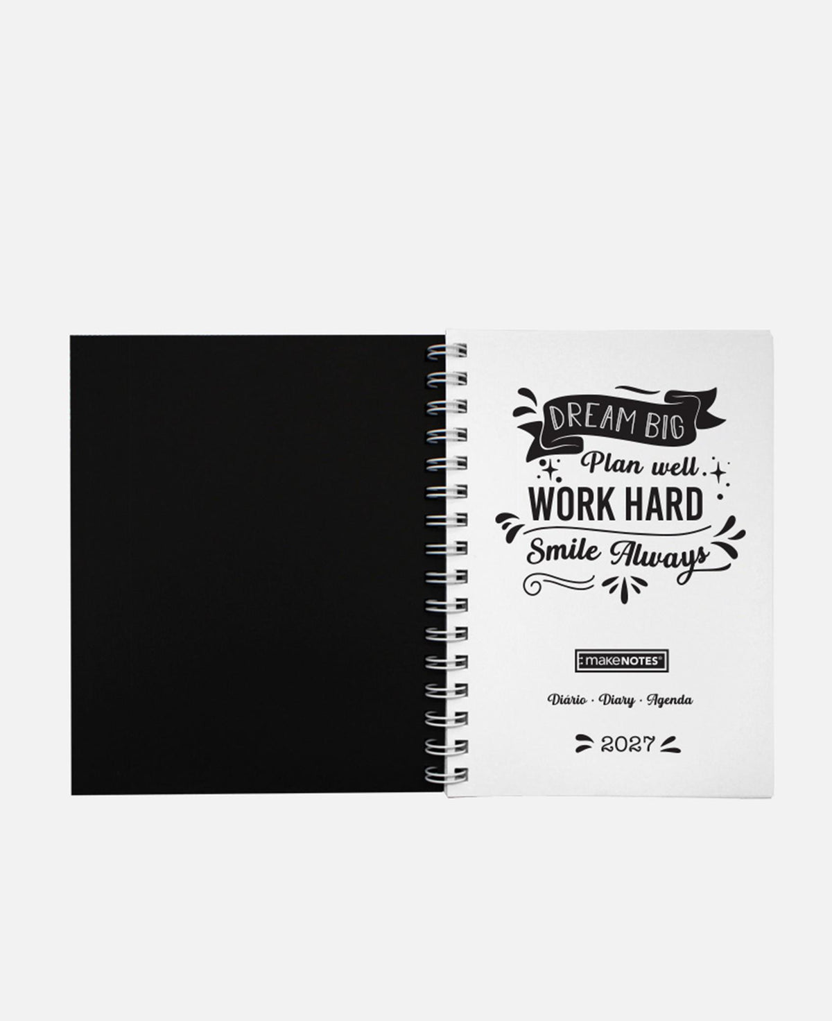 Agenda A5 aberta com espiral; página preta e folha branca com frases decorativas