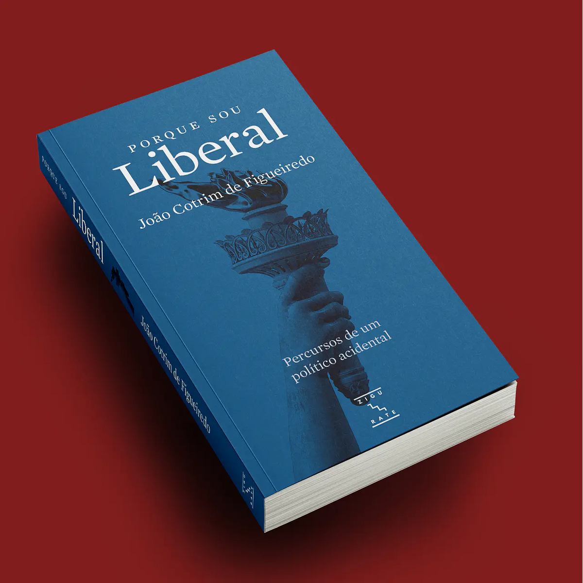 Livro de capa azul Porque sou Liberal com mão e balança