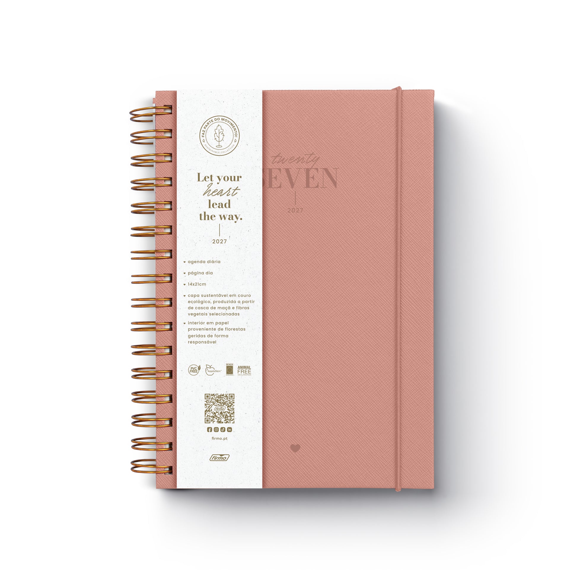 Agenda diária de 2027 Eco Millie com capa de design ecológico, encadernação em espiral e fecho de elástico disposta sobre uma secretária de trabalho.
