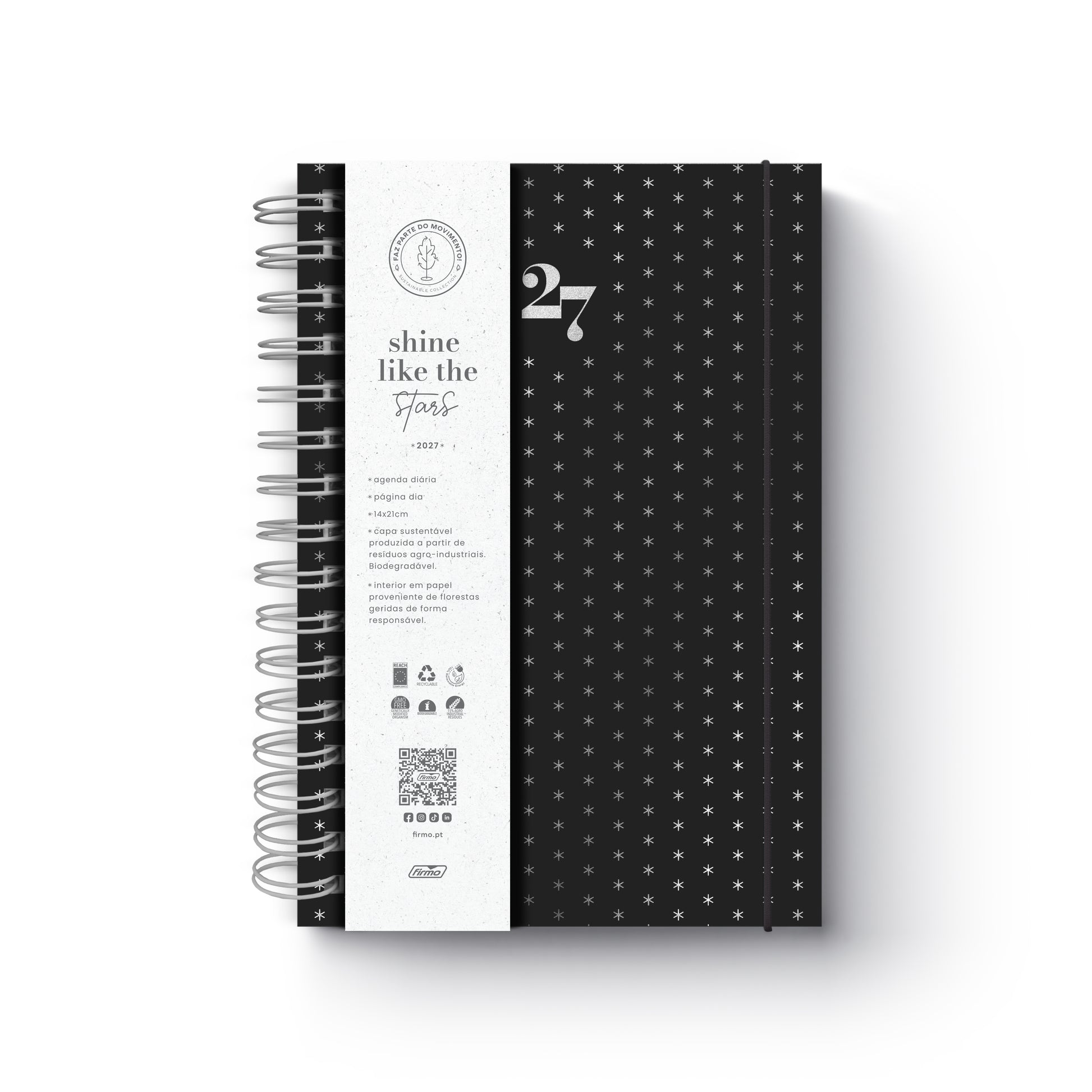 Agenda diária de 2027 Eco Skye da Firmo, em preto com padrão de pequenas estrelas prateadas, encadernação em espiral e uma faixa protetora branca com o texto "shine like the stars", sobre fundo neutro.