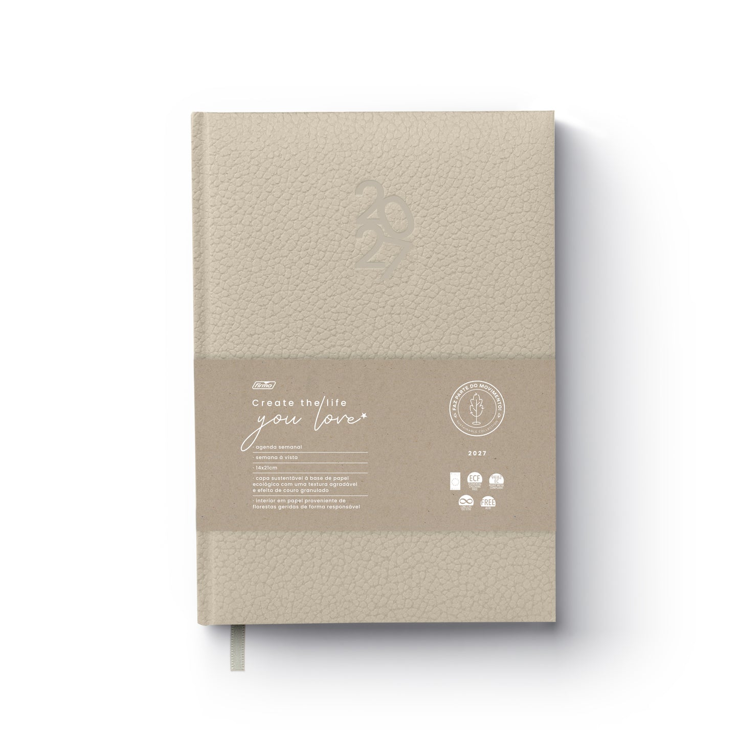 Agenda semanal de 2027 Eco Pearl da Firmo com capa almofadada bege texturada, exibindo uma cinta em papel kraft com a frase "Create the life you love" e certificações ambientais, sobre fundo branco.