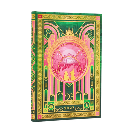 Agenda Wicked Collection 2027 com capa verde e rosa, medalhão circular e detalhes dourados.